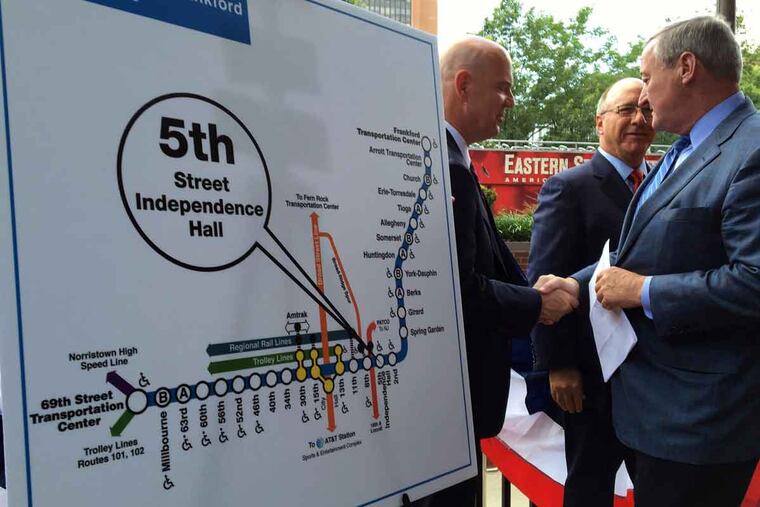 Mayor Kenney shakes hands with SEPTA GM Jeff Knueppel; board Chairman Pasquale Deon is at center.