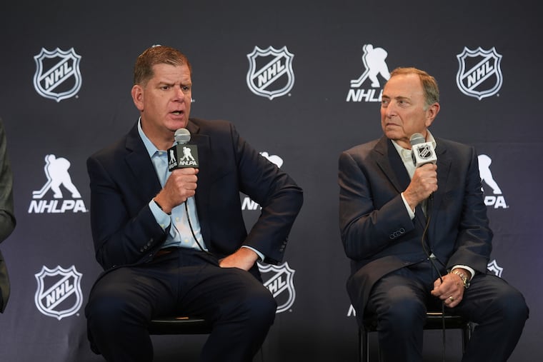 NHL players union head Marty Walsh (left) and commissioner Gary Bettman oversaw the ratification of a new collective bargaining agreement.