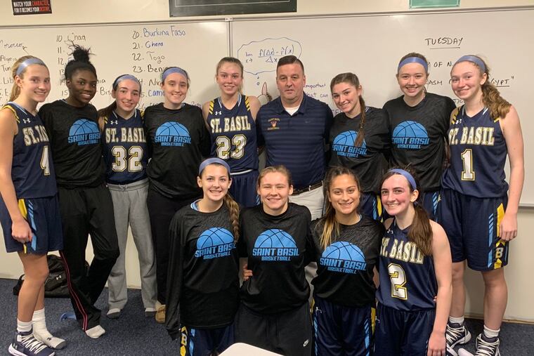 Terry Mancini celebrates with his players as he collected his 400th career victory in a win over Nazareth Academy.