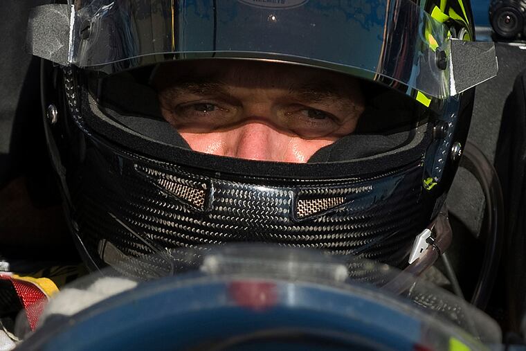 FILE- In this March 19, 2010, file photo, Level 5 Motorsports driver Scott Tucker waits during a break in a practice session for the American Le Mans Series' 12 Hours of Sebring auto race in Sebring, Fla. A U.S. appeals court has upheld a nearly $1.3 billion award against a pro racecar driver who ran a payday loan business accused by federal authorities of deceiving consumers. A unanimous three-judge panel of the 9th U.S. Circuit Court of Appeals ruled Monday, Dec. 3, 2018, that information Scott Tucker provided consumers did not accurately disclose the terms of the loans. The appeals panel also said a lower court did not abuse its authority when it ordered Tucker and other defendants to pay back nearly $1.3 billion. (AP Photo/Steve Nesius, File)