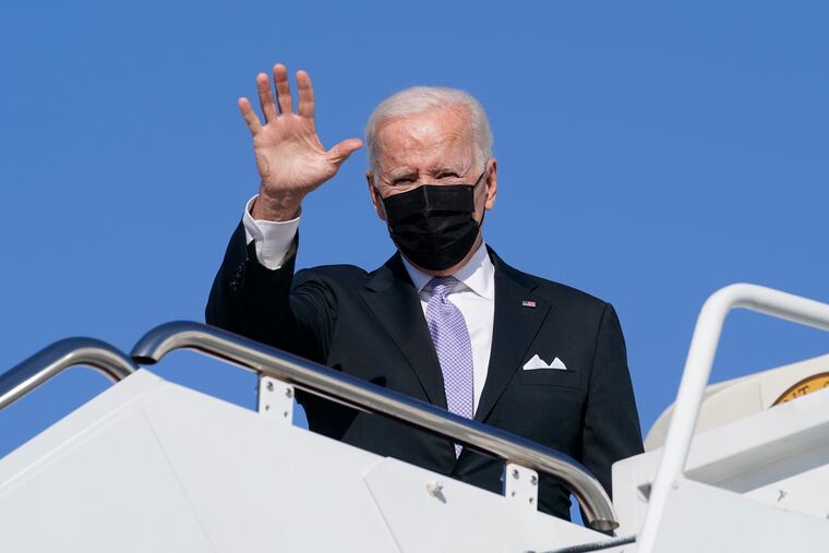 President Joe Biden waves as he boards Air Force One at Andrews Air Force Base, Md., to go to his hometown of Scranton.