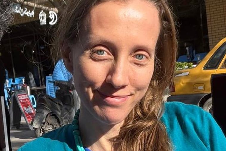 U.S. journalist Shelly Kittleson poses for a cellphone photo in a cafe in Baghdad, Iraq, Monday, March 30, 2026.