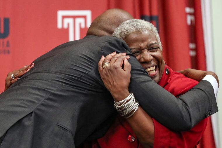 Nikki Franke hugs Temple President Jason Wingard after he spoke about her and her impact on the school.