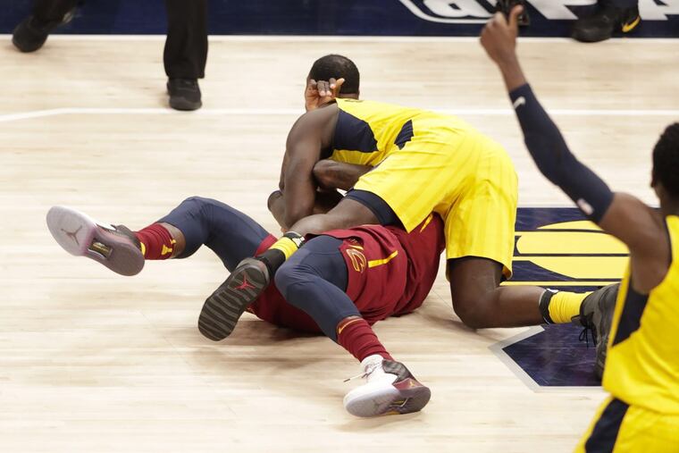 Indiana Pacers guard Lance Stephenson (1) ties up Cleveland Cavaliers forward Jeff Green (32) during the second half of Game 4 of an NBA basketball first-round playoff series in Indianapolis on Sunday. Stephenson was charged with a foul.