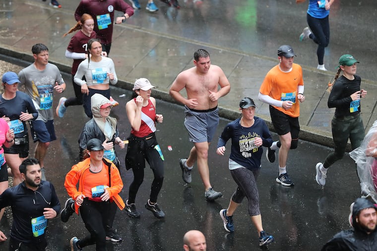 Runners take the bad weather in stride during the 43rd annual Independence Blue Cross Broad Street Run in Philadelphia, Pa on Sunday, April 30, 2023.