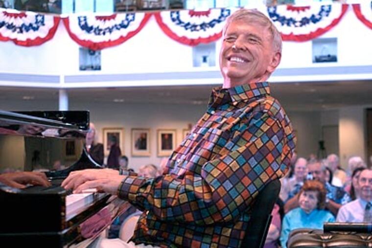 FILE - This Oct. 1, 2007 file photo shows Roger Williams playing the piano during his 83rd birthday celebration in Simi Valley, Calif. Williams, the virtuoso pianist who topped Billboard charts with his hit recording of "Autumn Leaves" in the 1950s and played for nine presidents during a long career, has died. He was 87. His former publicist Rob Wilcox says Williams died Saturday, Oct. 8, 2011 at his home in Los Angeles of complications from pancreatic cancer. (AP Photo/The Ventura County Star, Juan Carlo) NO MAGS, NO SALES, LA TIMES out; LA NEWS OUT; MANDATORY CREDIT FOR PRINT: JUAN CARLO / VENTURA COUNTY STAR; MANDATORY CREDIT FOR ONLINE: JUAN CARLO / WWW.VENTURACOUNTYSTAR.COM
