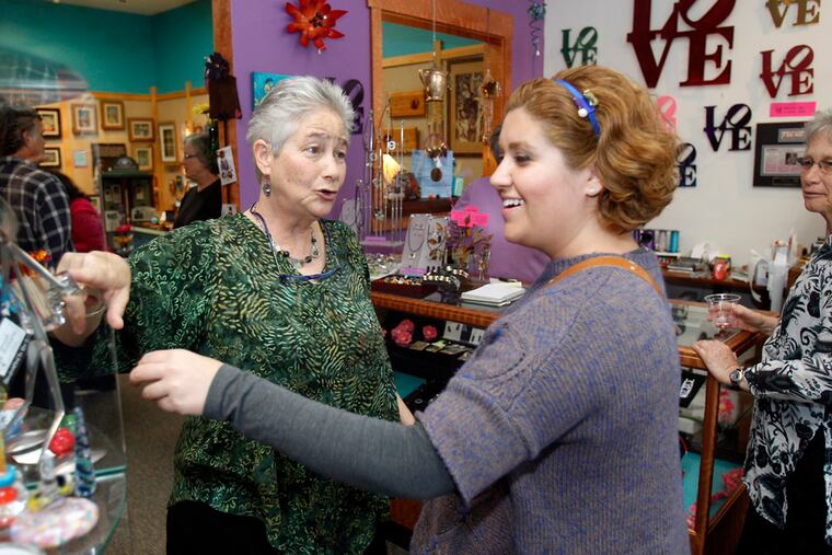 An owner, Elayne Aion (left) chats with customer Shahrzad Kojouri, from Ardmore, Pa., on Saturday. (Akira Suwa / Staff Photographer)