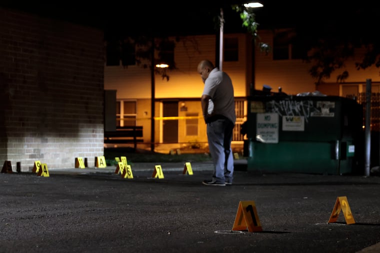 Police mark evidence after a 14 year old was shot in the area of Jackie’s Gardens Townhomes on the 1800 block of N. 20th St. in Philadelphia, Pa., on Sunday, August 13, 2023.