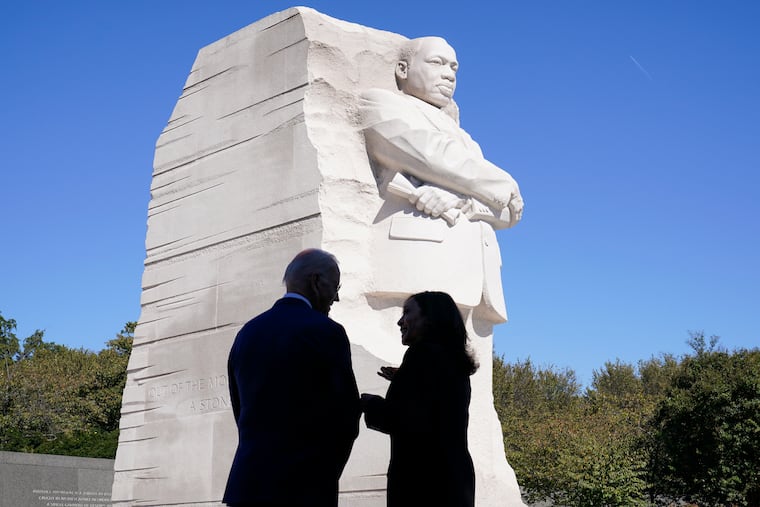 President Joe Biden and Vice President Kamala Harris stand together at the Martin Luther King, Jr. Memorial in 2021. This year marks the 60th anniversary of King's March on Washington for Jobs and Freedom.
