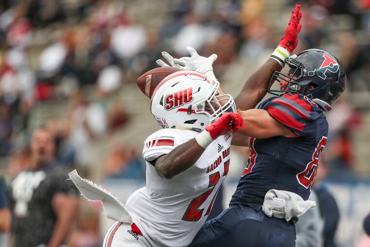 Penn wide receiver Ryan Cragun gets the pass interference call as Sacred Heart's Lamar Evans defends in the fourth quarter of a game at Franklin Field on Oct. 12, 2019. Penn won the game, 38-24.