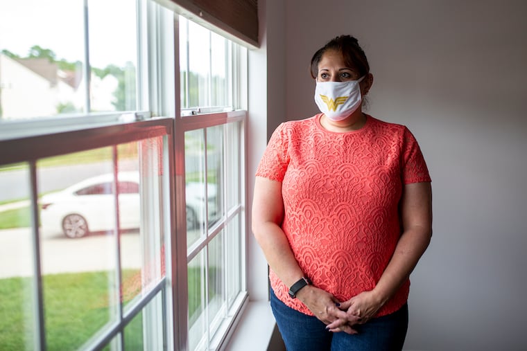 Debbie Wash, 55, a, teacher at Berlin Township Schools, poses for a portrait inside the home of Sage Uboh, 9, who she is tutoring in Sicklerville, N.J., on Wednesday, Aug., 26, 2020. Wash, of Berlin Township, N.J., has been a teacher for 32 years and has been tutoring for about three years.
