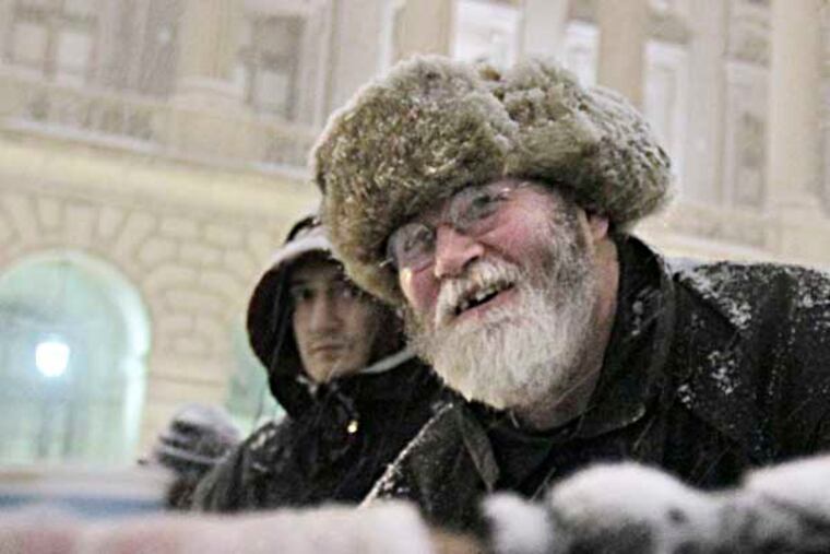 Cranford Coulter of Souderton serves his homemade soup to hungry people in the park on Vine St. between 18th and 19th St. in Phila. on January 2, 2014 ( ELIZABETH ROBERTSON / Staff Photographer )