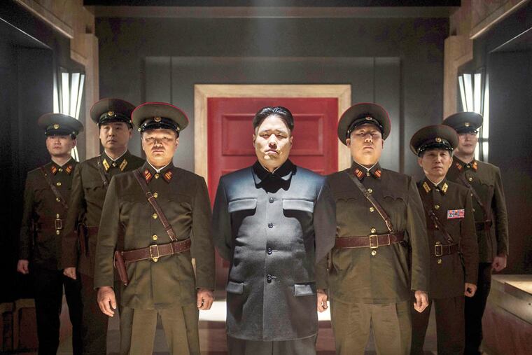 Actor Randall Park, center, portrays North Korean leader Kim Jong Un in Columbia Pictures' "The Interview." (AP Photo/Columbia Pictures - Sony, Ed Araquel)