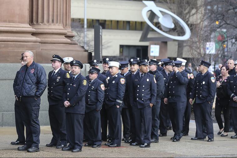 A viewing at the Cathedral Basilica of SS. Peter and Paul is held Thursday, Jan. 11, 2018, as fellow firefighters wait in line to pay their respects to Philadelphia Fire Department Lt. Matthew LeTourneau, 42, who died in a rowhouse fire last Saturday. LeTourneau was trapped under debris while battling the fire in North Philadelphia.