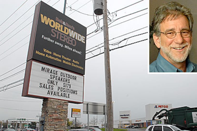 Bob Cole, owner of Bob and Ron's Worldwide Stereo, and his store in Montgomeryville. (April Saul / Inquirer)