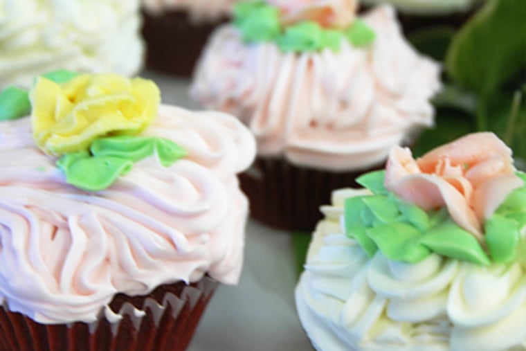 Cupcakes created for the Frismuth wedding by West Chester's Delightful Desserts & Culinary Creations. (James Heaney/Staff photographer)