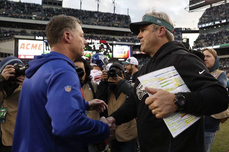 Doug Pederson shakes hands with New York Giants head coach Pat Shurmur after the Philadelphia Eagles' 25-22 win at Lincoln Financial Field.