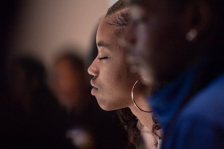 Jalen Williams (center), a ninth grader at George Washington Carver High School, closes her eyes during a meditation exercise in a "Happy from the Inside" workshop at the Pendle Hill Retreat Center in Wallingford, Pa. Carver is partnering with the Inner Strength Foundation to educate students in mindful awareness, focus, and compassion techniques.