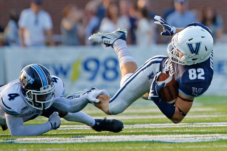 Villanova receiver Zac Kerxton (82) is taken down by Maine defensive Joshua Huffman on Sept. 28, 2019.