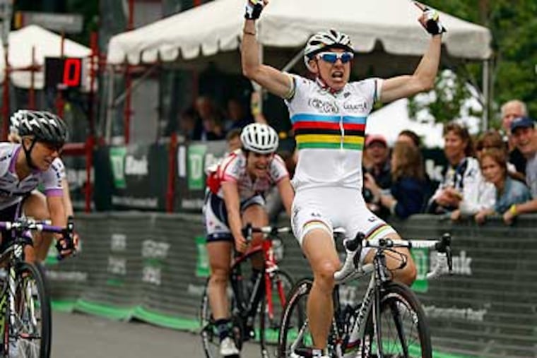Giorgia Bronzini celebrates after winning the women's race. (David Maialetti/Staff Photographer)