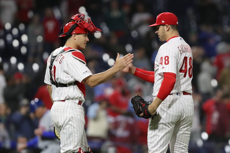 J.T. Realmuto congratulates Jerad Eickhoff after Eickhoff came in as relief during Tuesday's game.