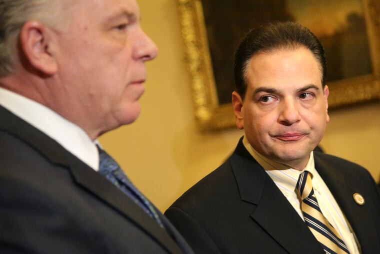 State Sen. Nick Scutari, right, sponsor of the marijuana legalization bill, looks on as Senate President Steve Sweeney speaks to reporters in Trenton, N.J., Monday, March 25, 2019. New Jersey's Senate president said there were not enough votes in the legislature to pass a bill to legalize recreational marijuana in the state. The vote in that chamber has been postponed. (AP Photo/Seth Wenig)