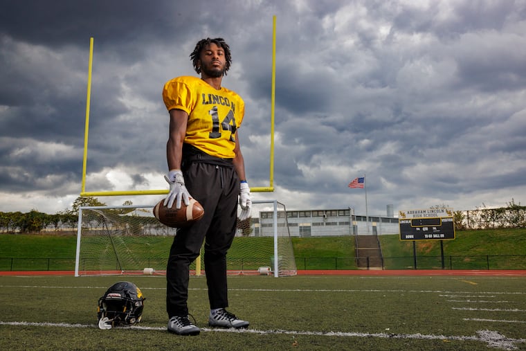 Roling Davis, a senior wide receiver at Lincoln, lost a friend, Syeer Smith, to cancer. He displays "Ball4Sa" on tape for towel for every game in memory of his friend.