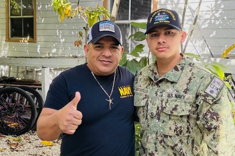 This photo courtesy of Katherine Delgado shows her stepfather, Luis Manuel Aviles (left) and her brother Joshua Aviles outside their home in Key West, Fla., in Oct. 2025, shortly before Joshua deployed on the USS Lincoln.