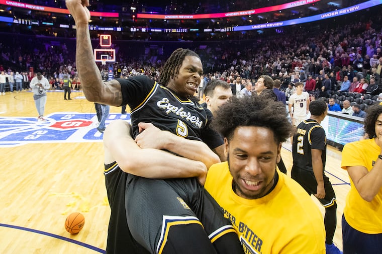 La Salle's Khalil Brantley was lifted up by teammates after his buzzer-beating three-pointer in overtime that beat Penn.