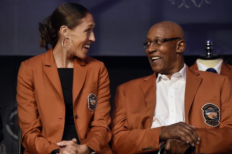 Basketball Hall of Fame inductee Rebecca Lobo shares a light moment with George McGinnis.