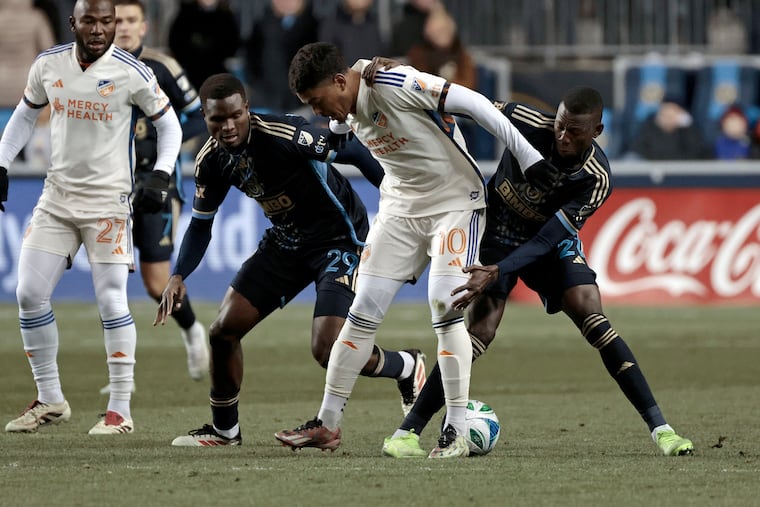 The Union’s Olwethu Makhanya (left) and Danley Jean Jacques helped keep Cincinnati playmaker Evander relatively quiet during Saturday's game.