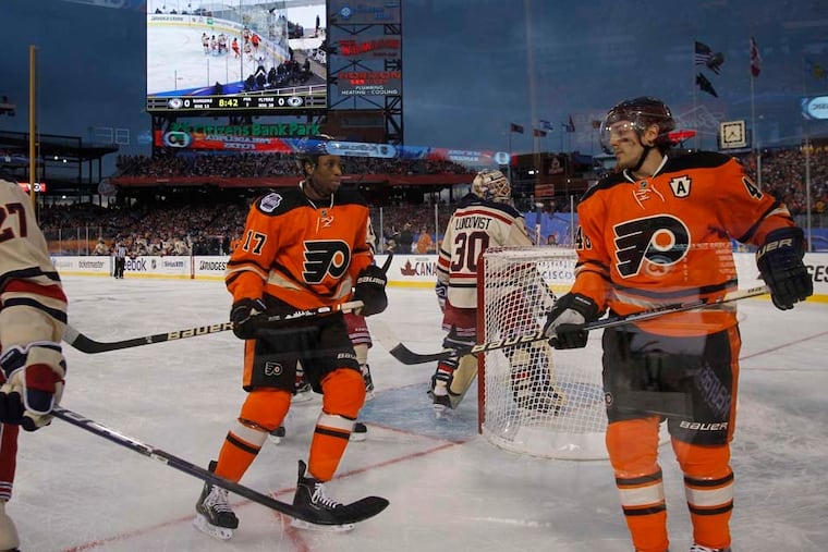 The Flyers' Wayne Simmonds (17) and Danny Briere skating around the net during the 2012 Winter Classic against the Rangers at Citizens Bank Park. Simmonds, who is on the trade block, could be playing his final game as a Flyer on Saturday at Lincoln Financial Field.