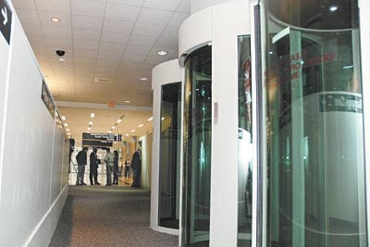 Electronic security pods are installed at Atlantic City International Airport, which has aviation research facilities nearby. (RICH KRENTS / For The Inquirer)