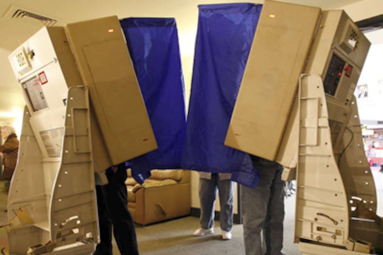 Voters cast their ballots inside the Mummers Museum on Second Street during Election Day in 2010. (David Maialetti / Staff Photographer)