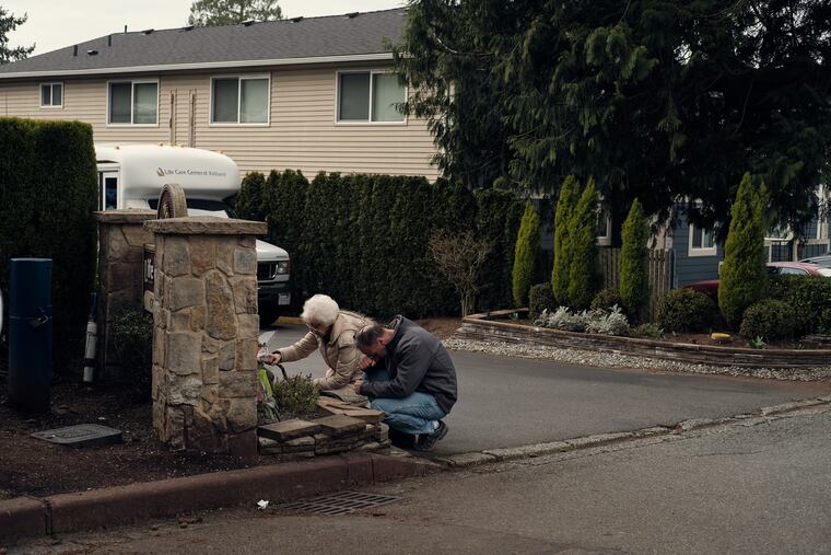 Judy Layton and her son prayed for the victims at the Life Care Center of Kirkland in Kirkland, Wash., on March 10.