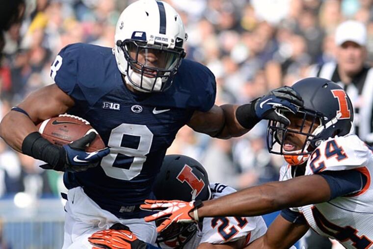 Penn State's Allen Robinson (6) tries to elude Illinois defenders Zane Petty (21) and Darius Mosely (24) in the first quarter of an NCAA college football game against Illinois in State College, Pa., Saturday, Nov. 2, 2013. (AP Photo/John Beale)