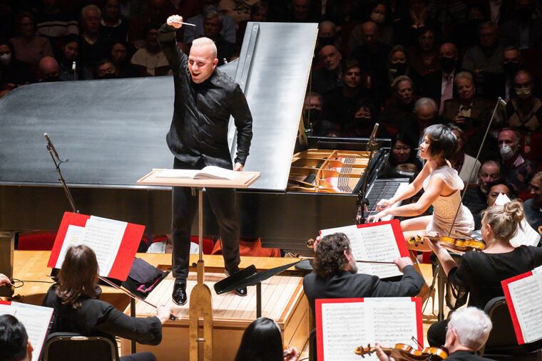 Philadelphia Orchestra music director Yannick Nézet-Séguin with pianist Yuja Wang performing Rachmaninoff Thursday in Verizon Hall.