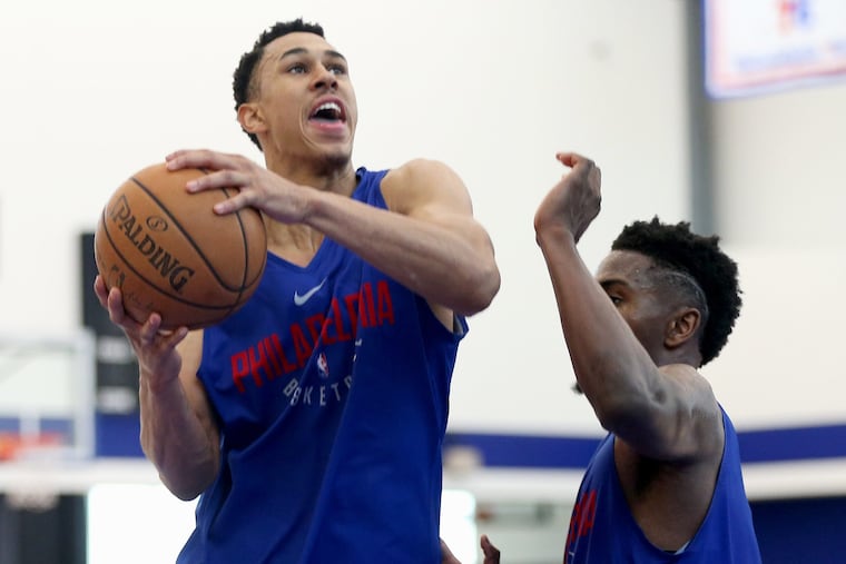 Texas Tech guard Zhaire Smith, left, drives against Loyola-Chicago's Donte Ingram during the Sixers workout.