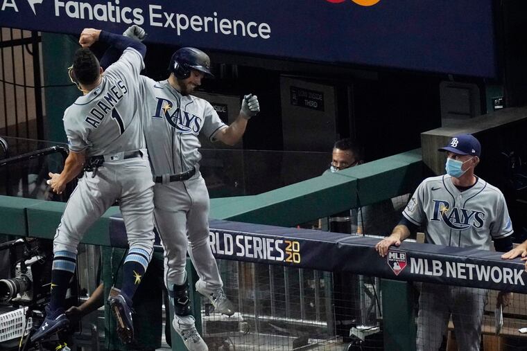 Tampa Bay's Brandon Lowe (right) celebrates a two-run home run with Willy Adames in the fifth inning of Game 2.