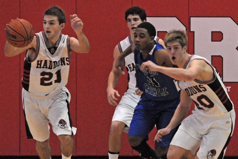 Haddonfield guard Nick DePersia (21), with teammates Tom Kadar (rear) and Teddy Stavetski, stretches defenses with his shooting range. The 26-0 Bulldogs begin the S.J. Group 2 tournament Tuesday against Deptford.