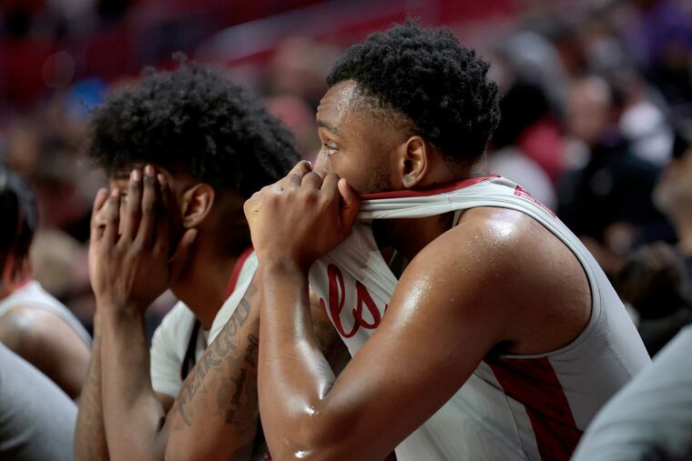 Jahlil White (left) and Jamille Reynolds of Temple sit dejected on the bench late in their loss to Wichita State at the Liacouras Center on Feb. 16, 2023.