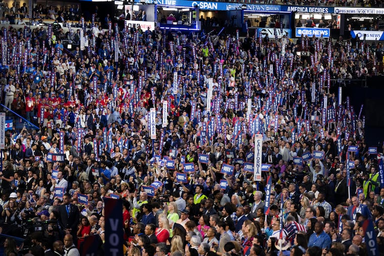 Democrats cheer during Michelle Obama’s remarks on Wednesday, Aug. 21, 2024, during the 2024 DNC in Chicago.