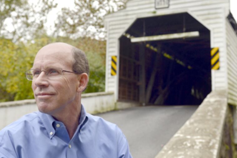 Pete K. Hoover stands near Gibson's Covered Bridge in Downingtown, Chester County. (Tom Gralish / Staff Photographer)