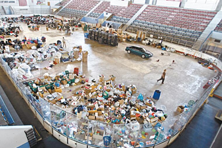 Items left behind by Penn students will be distributed to nonprofits and community groups. The Class of 1929 Ice Rink is used to house the items. (Michael S. Wirtz / Inquirer).