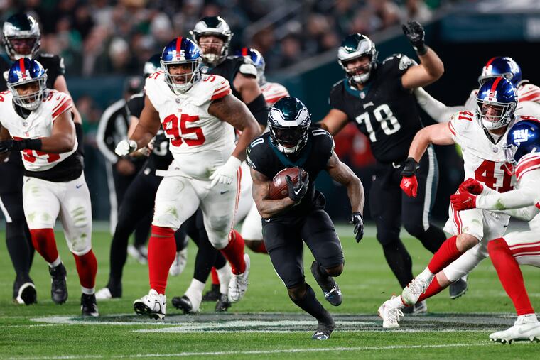 Eagles running back D'Andre Swift runs with the football against the New York Giants on Monday, Dec. 25, 2023 in Philadelphia.