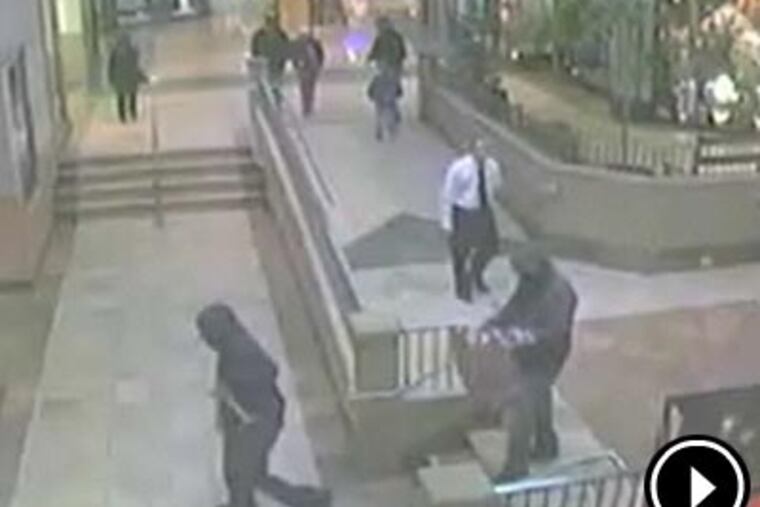 Surveillance video captured two thieves entering the Diamond Depot store in the Franklin Mills Mall.