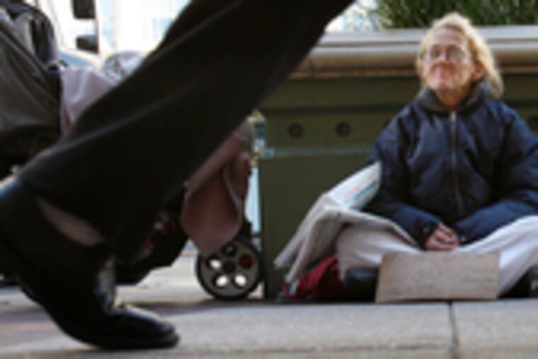 In Philadelphia, Yolanda Radzewicz begs on Market Street near Eighth. Homeless since 2000, she'd like to get off the streets but resists shelters.