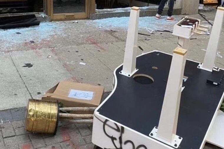 Four vandals pulled this grand piano out of a store on Saturday night and left it on Chestnut Street.