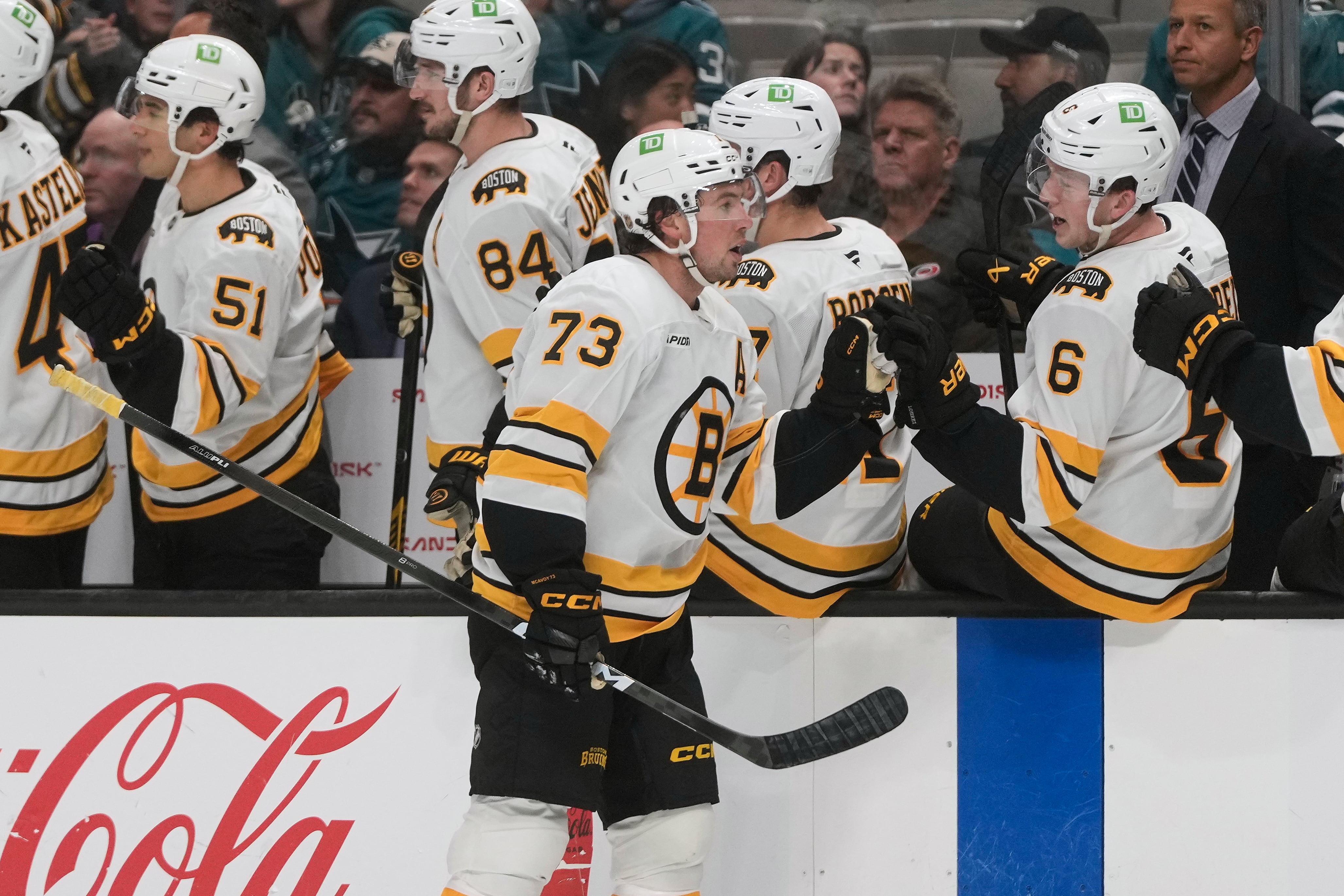 McAvoy scores in his 1st game back from a suspension to lead the Bruins past the Sharks 6-3