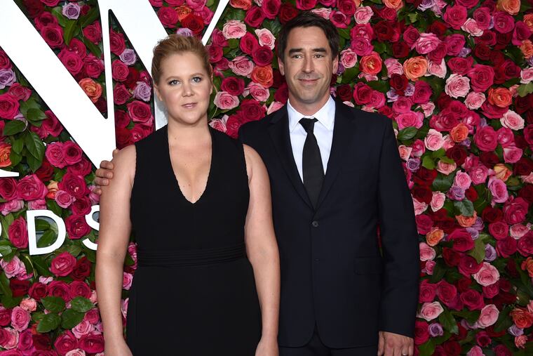 FILE - This June 10, 2018 file photo shows Amy Schumer, left, and Chris Fischer at the 72nd annual Tony Awards in New York. Schumer gave birth to a son with husband Fischer Sunday night, May 5, 2019, according to her Instagram where she posted a photo of her family of three. In the caption she writes that at “10:55 p.m. last night. Our royal baby was born.” (Photo by Evan Agostini/Invision/AP, File)